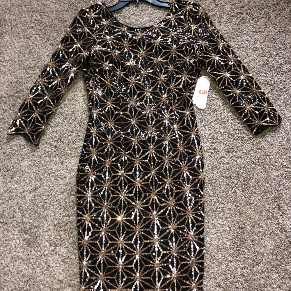 Tight fitted black and gold party dress